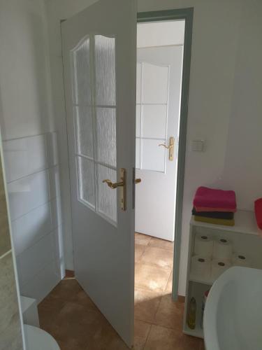 an open door in a bathroom with a toilet at Penzion U Pavla in Most