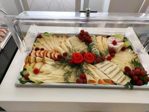 a display case filled with cheese and other foods at Eventhaus Schamin in Erpen
