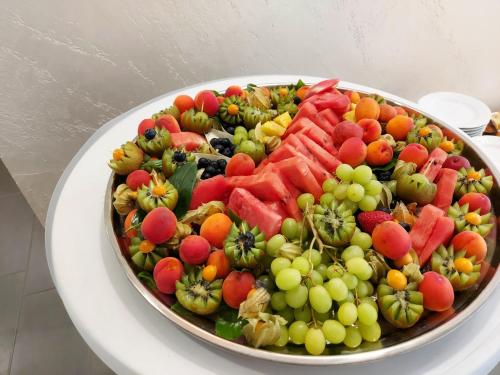 a plate of fruits and vegetables on a table at Eventhaus Schamin in Erpen