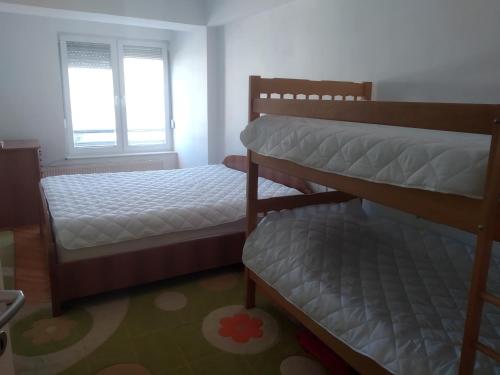 Katil atau katil-katil dalam bilik di Apartman Aleksandra