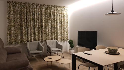 a living room with a couch and a table at Casa Raquel,caminito del Rey in Valle de Abdalagís