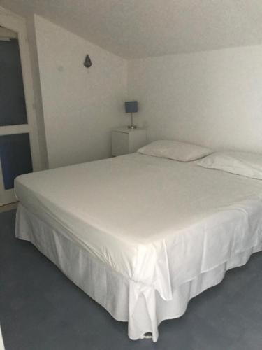 A bed or beds in a room at Mansarda Marinello