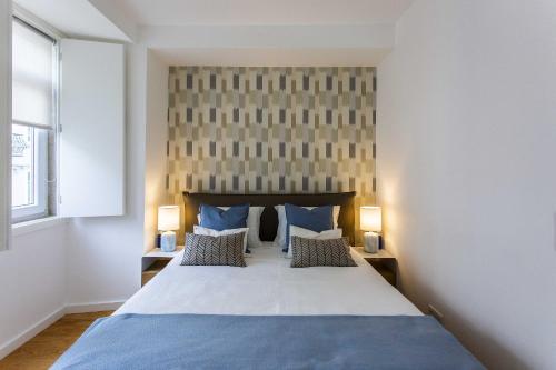 En eller flere senge i et værelse på Prestige Ajuda Apartment