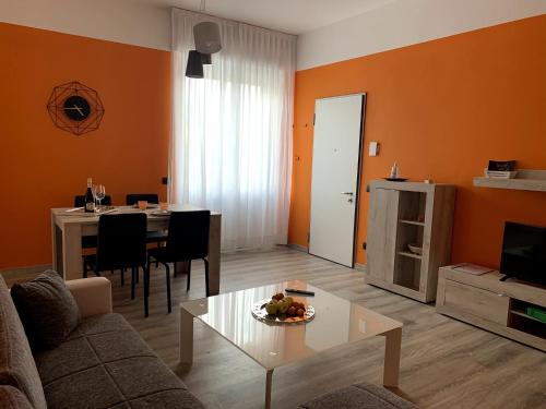 a living room with a couch and a table at Appartamento Lucia, Lago di Como, Dongo in Dongo