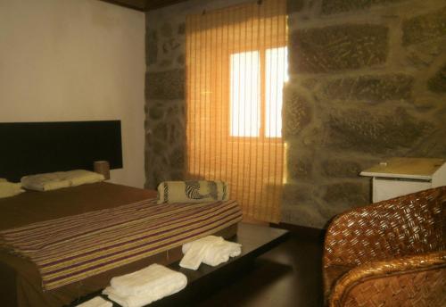 A bed or beds in a room at Village Minhoure
