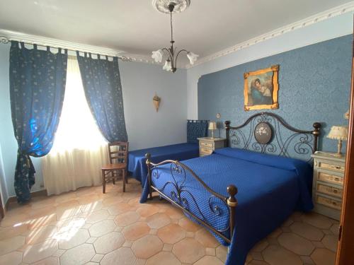 מיטה או מיטות בחדר ב-Villa Russo