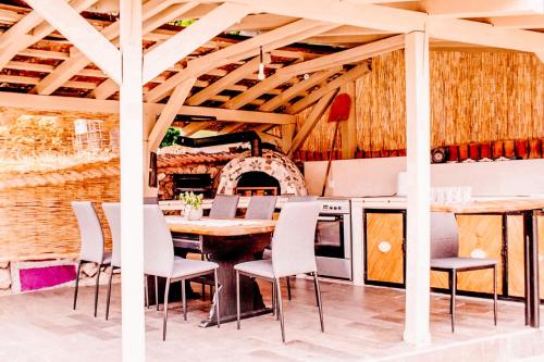 a dining room with a table and chairs at Paradise garden in Sarajevo