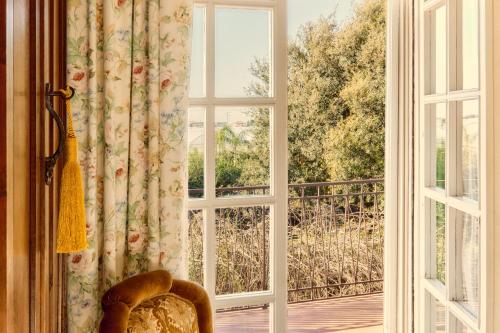 an open window with a view of a balcony at Casa Consalvo B&b in Pontecagnano