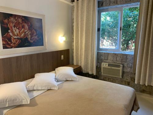 Katil atau katil-katil dalam bilik di Hotel La Ponsa Itatiaia