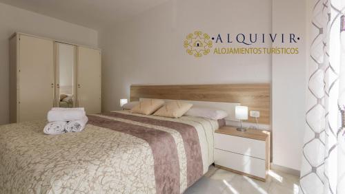 Кровать или кровати в номере Apartamento El Califa - 2 Habitaciones