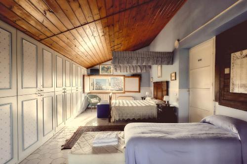 a bedroom with a bed and a room with a table at Casa Consalvo B&b in Pontecagnano