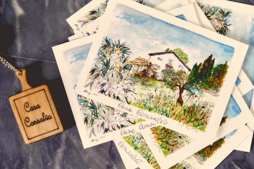 a pile of cards with a drawing of a house at Casa Consalvo B&b in Pontecagnano