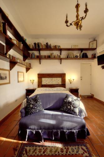a bedroom with a bed and a couch in it at Casa Consalvo B&b in Pontecagnano