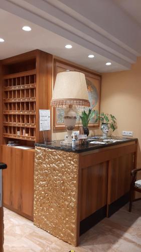 a kitchen with a counter with a lamp on it at Park Hotel Fantoni in Tabiano