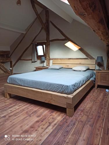 En eller flere senge i et værelse på Le vieux tilleul