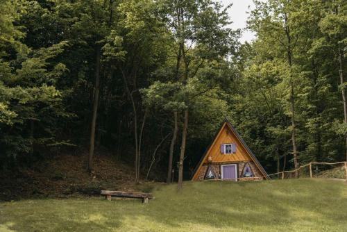 a wooden cabin in the middle of a forest at Etno Village Dolina Sreće in Vitez