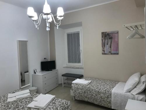 Ένα ή περισσότερα κρεβάτια σε δωμάτιο στο Residenza Aurea