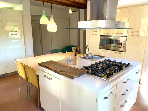 a kitchen with a stove and a counter top at Tenuta Santa Lucia in Silea