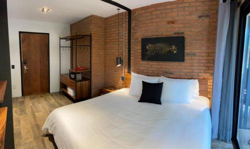 Katil atau katil-katil dalam bilik di Hotel Oxú Solo adultos