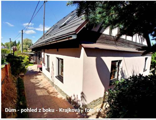 a house with a solar roof on top of it at West Bohemian Home, Krajkova 208 in Krajková