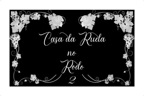 a black and white card with a floral frame at Casa da Ruela no Rodo in Peso da Régua