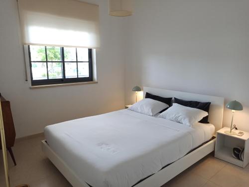 Postel nebo postele na pokoji v ubytování ACC Apartamento T1 Palmela Village