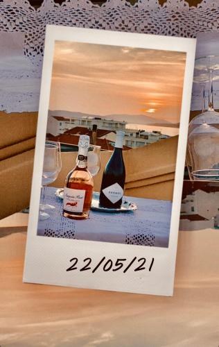 a picture of two bottles of alcohol on a table at B&B Su Canistreddu in Alghero