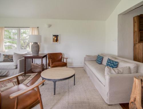 a living room with a couch and a table at Contigo Ranch Fredericksburg in Fredericksburg