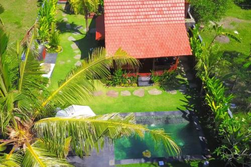 an aerial view of a house with a swimming pool at The Hidden Escapes Manggis- Stunning Hidden Gem Villa with Pool, Sauna & Ice Bath in Padangbai