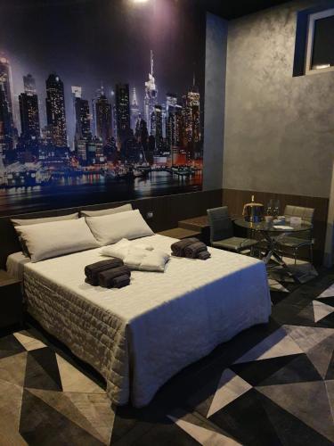 a bedroom with a large bed with a view of a city at Foresterie Lombarde B&B Villa Ambra in Limbiate