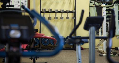 a gym with a bunch of equipment in it at Bird Of Paradise Hotel in Goroka