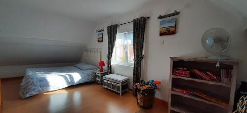 Postel nebo postele na pokoji v ubytování Gîte "Entre fraises et mer"