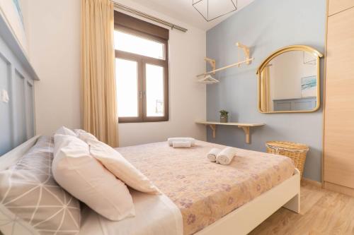En eller flere senger på et rom på Blue Sea Relax Apartment