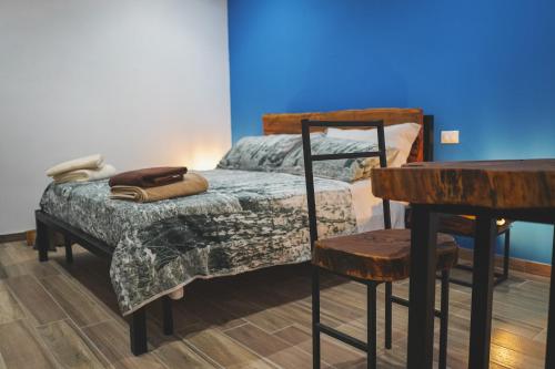 Ένα ή περισσότερα κρεβάτια σε δωμάτιο στο Ulivo Design b&b