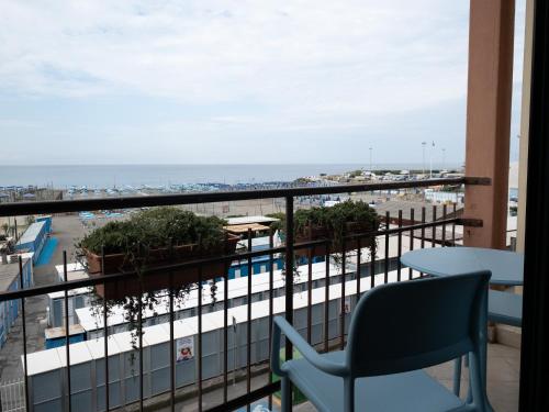 a balcony with chairs and a view of the ocean at Hotel Santa Maria in Chiavari
