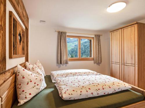 Llit o llits en una habitació de Pfattenspitz Maurerhof