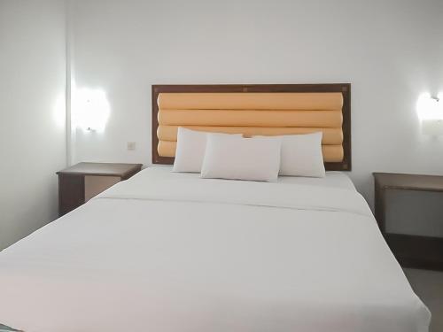 Кровать или кровати в номере RedDoorz Syariah near Sunrise Park Pangandaran