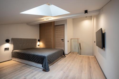 Voodi või voodid majutusasutuse CLINICUS Apartments toas