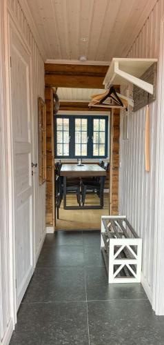 a dining room with a table in a cabin at The Fryksås Chamber in Orsa