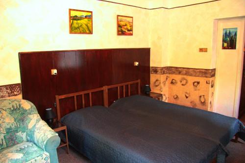 a bedroom with a bed and a couch at Villa Sunshine / Slunečna Vila in Krásná Lípa