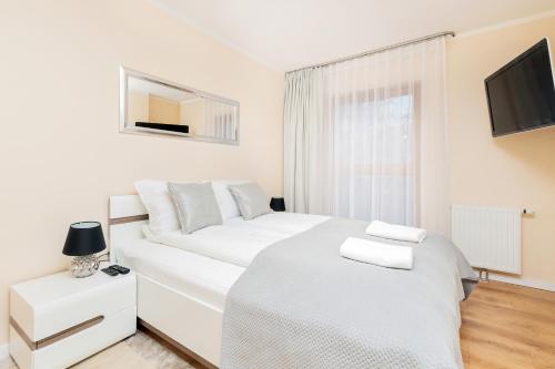 Posteľ alebo postele v izbe v ubytovaní Batorego 7 Gdynia Apartments by Renters