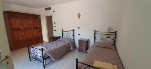 מיטה או מיטות בחדר ב-Casa per ferie religiosa Figlie di Nazareth