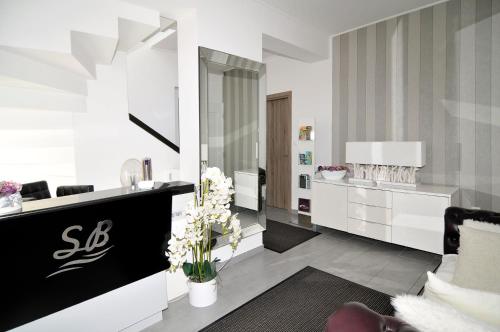 a living room with a vanity and a mirror at Silver Beach Apartments in Siófok