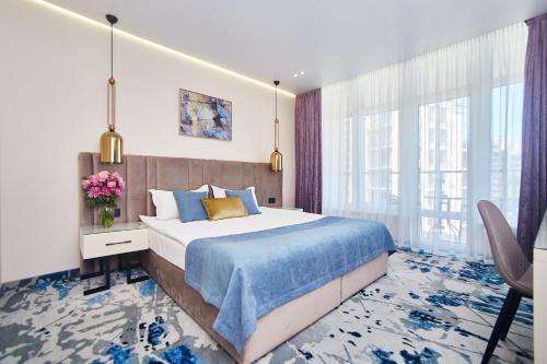 Postel nebo postele na pokoji v ubytování Jupiter Hotel