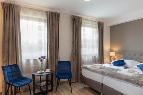 Кровать или кровати в номере Dominik Hotel & Eventsaal