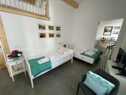 A bed or beds in a room at SanTelmo27A