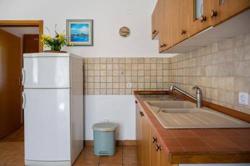 Kuchyň nebo kuchyňský kout v ubytování Golden Cape Apartments
