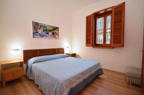 เตียงในห้องที่ Villetta Crumisi