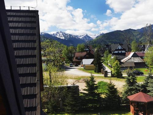 a view of a town with mountains in the background at Zakopane apartament in Zakopane