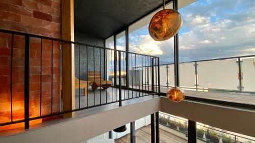a balcony with a view of the ocean at Aparthotel Central Liptovský Mikuláš in Liptovský Mikuláš